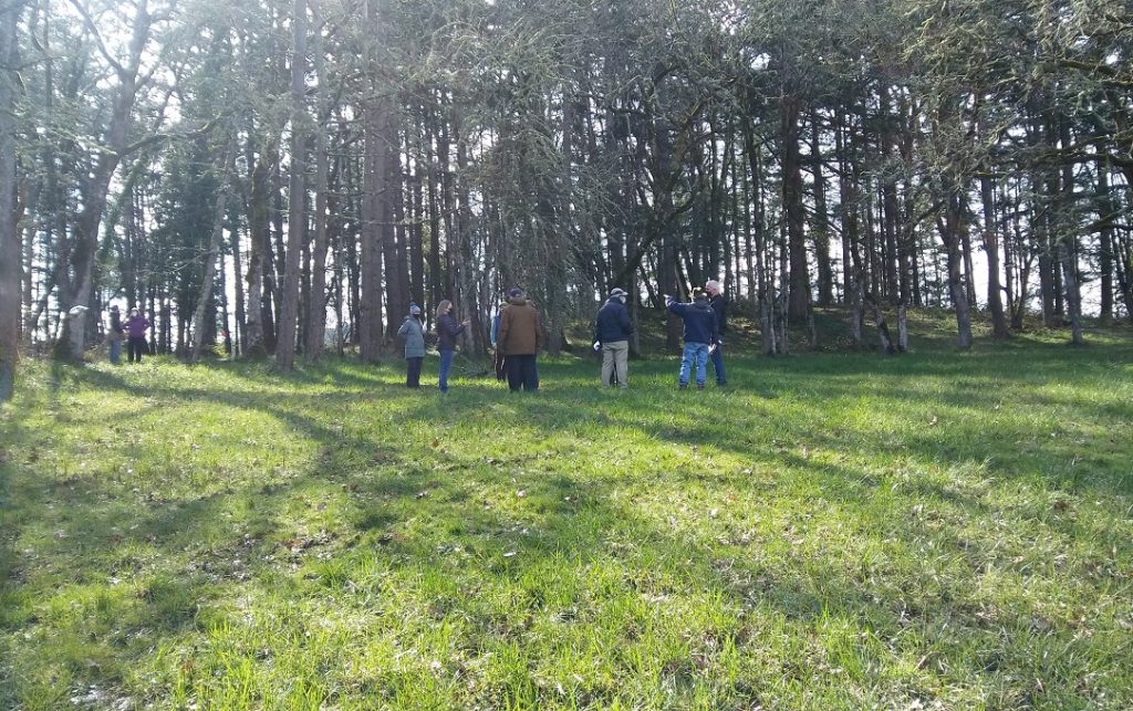 Neighbors gather at the EWEB site near Patterson and East 40th for a tour on March 6, 2021. Speakers at the July EWEB board meeting asked for a public hearing on the decision to build two water tanks at the site now.