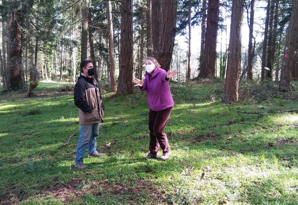 Sandra Bishop gestures while giving a tour of the Patterson Hill habitat to a neighborhood board member on March 6, 2021.