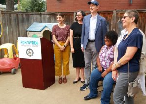 Kerry Willhite, Andrea Paluso, Sen. Ron Wyden, Maisie Davis, Amber Childress, and Lane County Commissioner Laurie Trieger gather for a group photo at Oak Street Child Development Center on June 30, 2021.