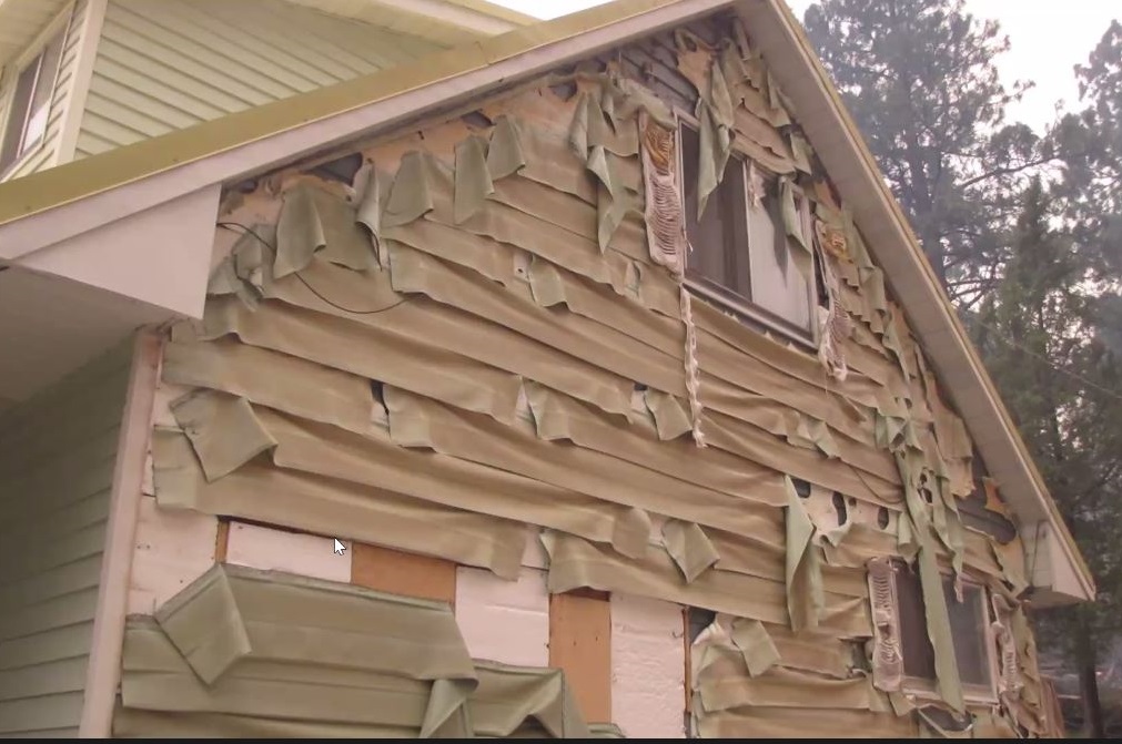 Vinyl siding melted in the heat from a wildfire, making the home more vulnerable to ember wash. (Irene Jerome presentation)